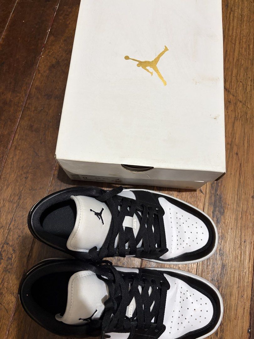Air Jordan 1 Low WMNS White Black (Category: Sneakers) located in Pasig City. Submitted by preloved_items_roche (Listing ID 1464014108, Image 2). Description: - Brand: Nike Air Jordan 1 Low - Colorway: White and Black - Size: 9 US Women's - Condition: Comes with original box - Ideal for: Casual wear and everyday style With box and receipt.