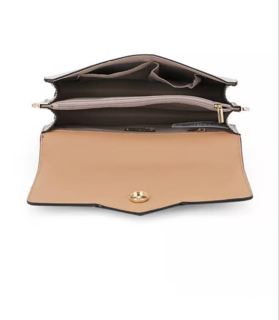 ALDO Crossbody Bag (Category: Cross-body Bags) located in Manila. Submitted by _preciousfinds.2 (Listing ID 1464017116, Image 3). Description: - Stylish tan, black, and cream colorblock design - Elegant gold-tone circular logo on the front flap - Versatile with a detachable black shoulder strap and a chic gold chain strap - Organized interior with multiple compartments - Unique snake print detail on the sides - Ideal for everyday use and adding a