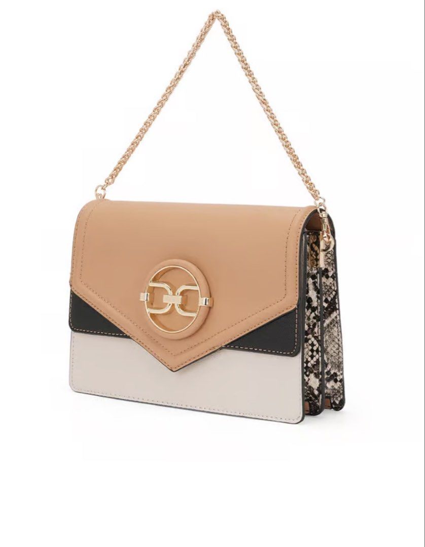 ALDO Crossbody Bag (Category: Cross-body Bags) located in Manila. Submitted by _preciousfinds.2 (Listing ID 1464017116, Image 2). Description: - Stylish tan, black, and cream colorblock design - Elegant gold-tone circular logo on the front flap - Versatile with a detachable black shoulder strap and a chic gold chain strap - Organized interior with multiple compartments - Unique snake print detail on the sides - Ideal for everyday use and adding a