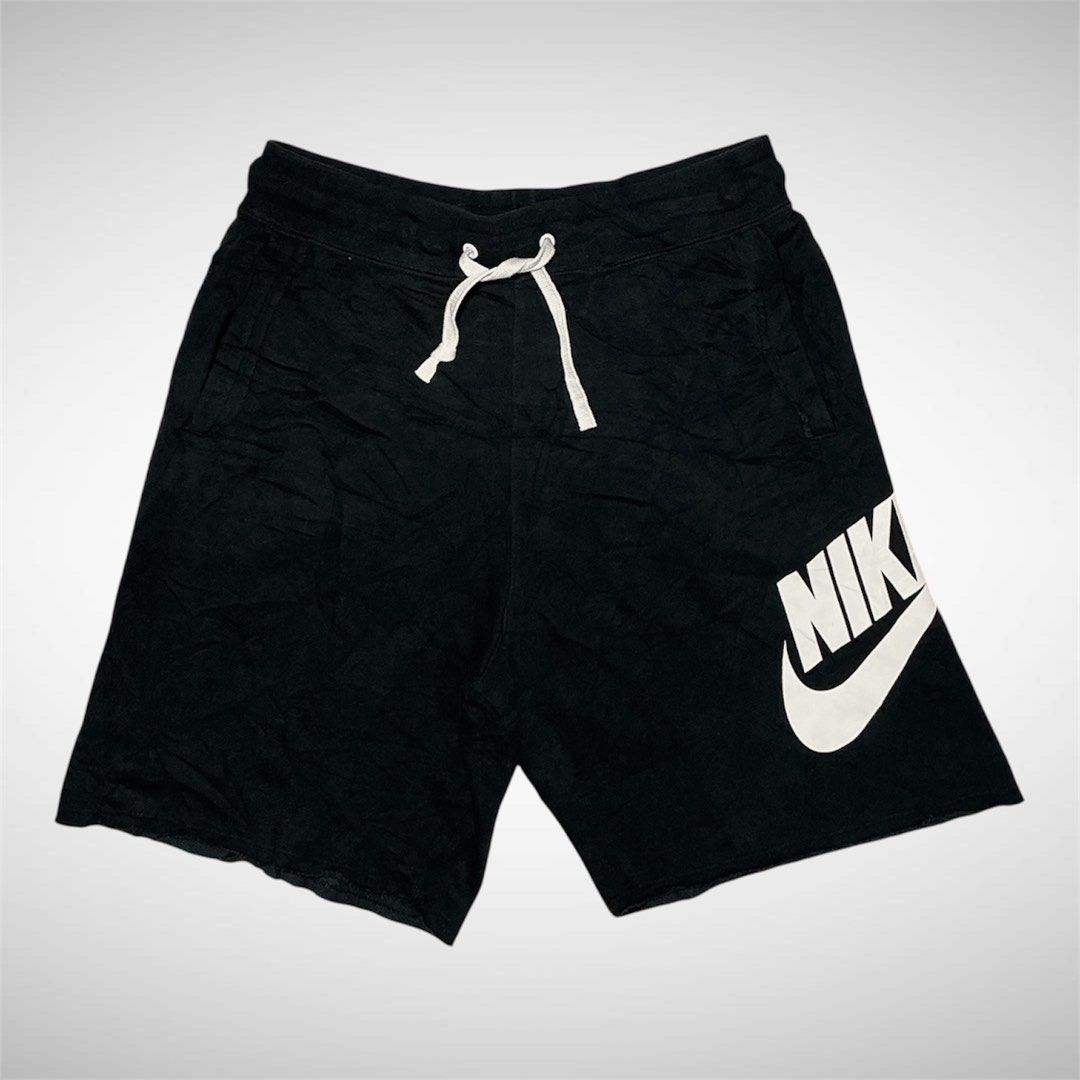 Alumni Nike Black Jersey Shorts with Large Logo (Category: Shorts) located in Naga. Submitted by eunhasowon12391 (Listing ID 1464009162, Image 1). Description: - Black Nike shorts - Size M - Comfortable cotton blend fabric - Adjustable drawstring waist for a perfect fit - Iconic big white swoosh logo - Ideal for workouts, gym, or casual lounging.