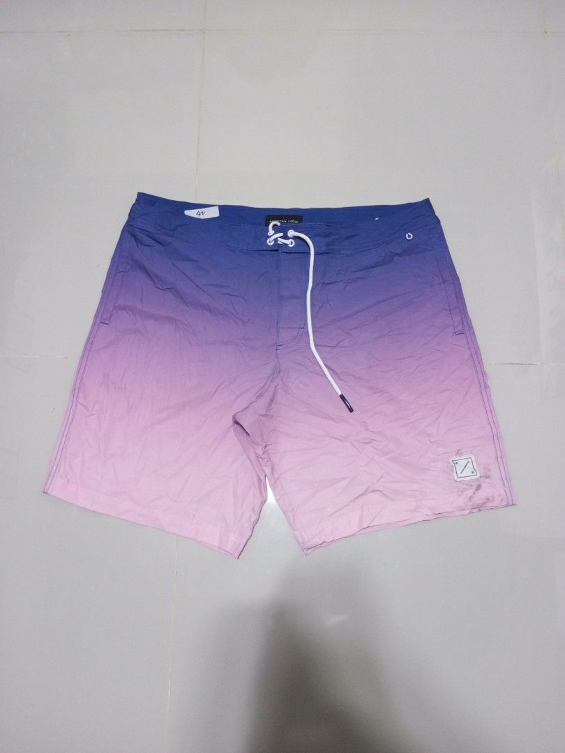 American Eagle Ombre Boardshorts XL (Category: Swim Trunks & Board Shorts) located in Magdalena. Submitted by magdalenathrift20 (Listing ID 1464069423, Image 2). Description: - Brand: American Eagle - Size: XL - Color: Blue to pink ombre design - Waistline: Fits 40-42 inches - Length: 20.5 inches - Ideal for swimming and lounging.