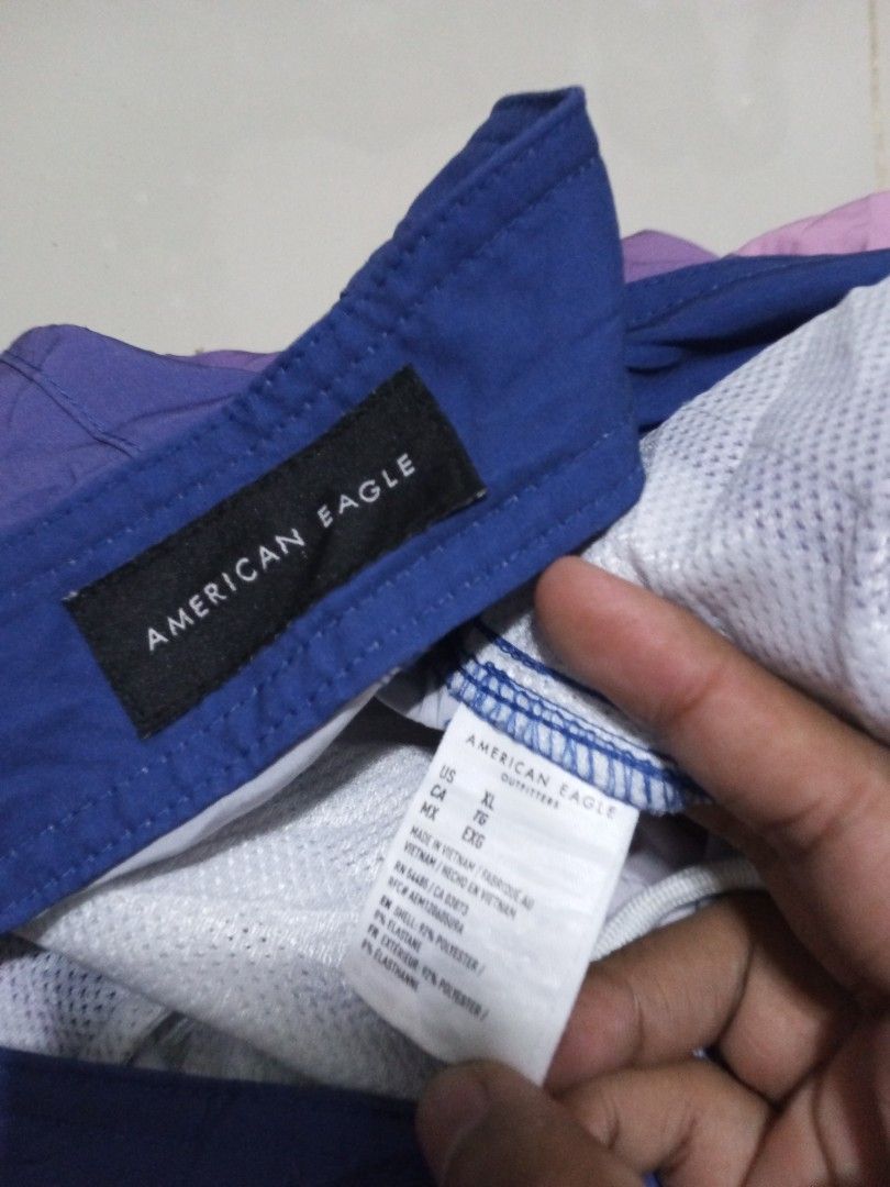 American Eagle Ombre Boardshorts XL (Category: Swim Trunks & Board Shorts) located in Magdalena. Submitted by magdalenathrift20 (Listing ID 1464069423, Image 3). Description: - Brand: American Eagle - Size: XL - Color: Blue to pink ombre design - Waistline: Fits 40-42 inches - Length: 20.5 inches - Ideal for swimming and lounging.
