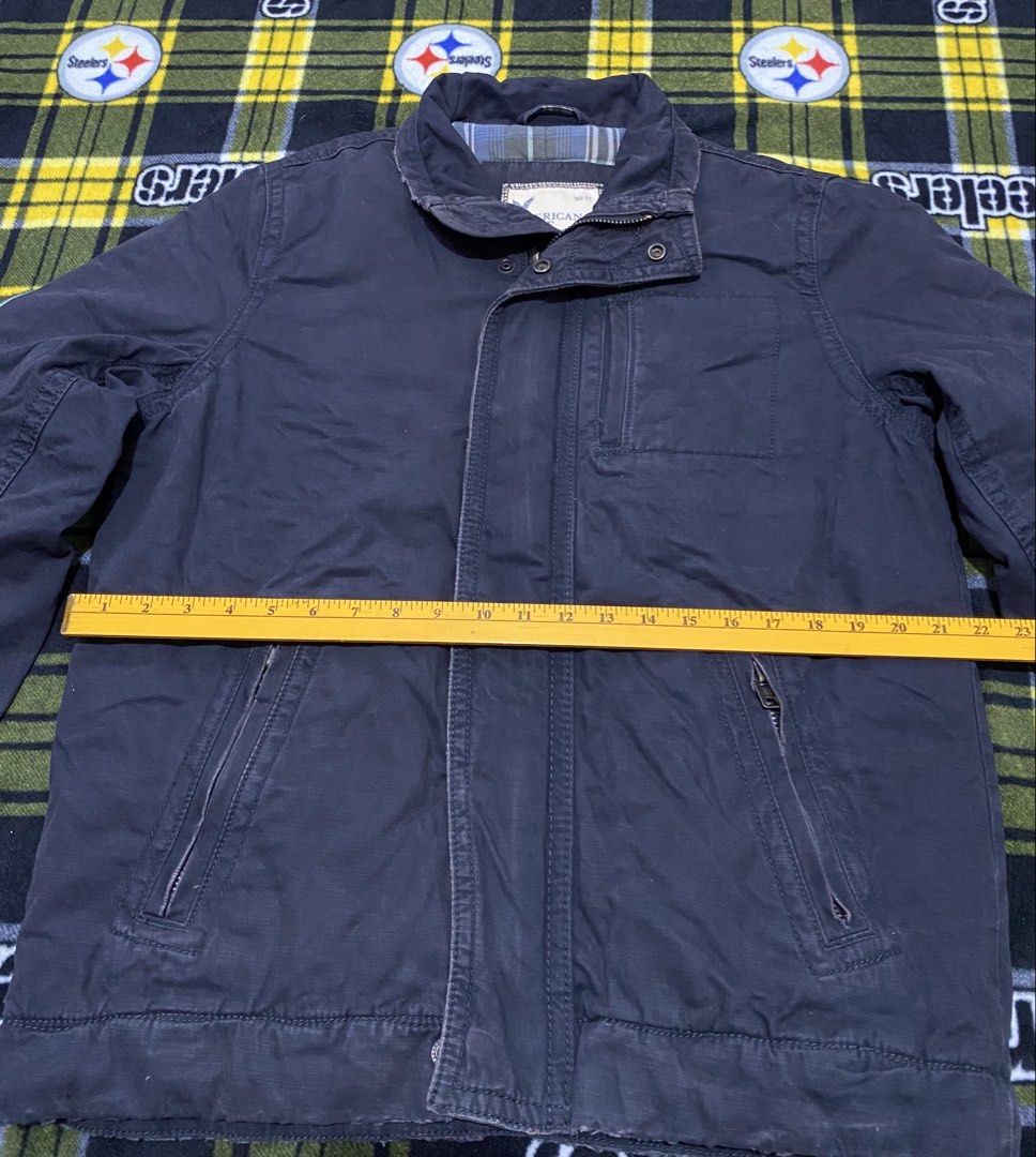 AMERICAN EAGLE,Full zip jacket (Heavy cloth) (Category: Coats, Jackets and Outerwear) located in Cavite. Submitted by jc_thrift95 (Listing ID 1464051012, Image 3). Description: - a dark blue American Eagle Outfitters canvas field jacket featuring a distinctive stand-up collar and zippered front pockets. - Made in India - Color rate 8/10 - See pictures details for dimes..