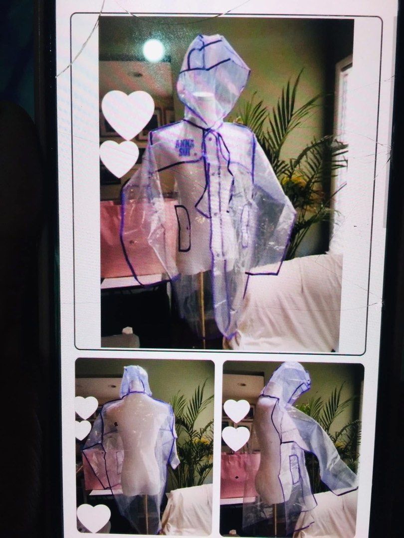 Anna Sui Clear Transparent Raincoat (Category: Coats, Jackets and Outerwear) located in Baguio. Submitted by izza_thrifty (Listing ID 1464081918, Image 2). Description: - Brand: Anna Sui - Type: Clear Raincoat - Features: Purple trim, floral details - Design: Hooded, buttons up the front, front pockets - Condition: Great for rainy days, comes in original packaging.