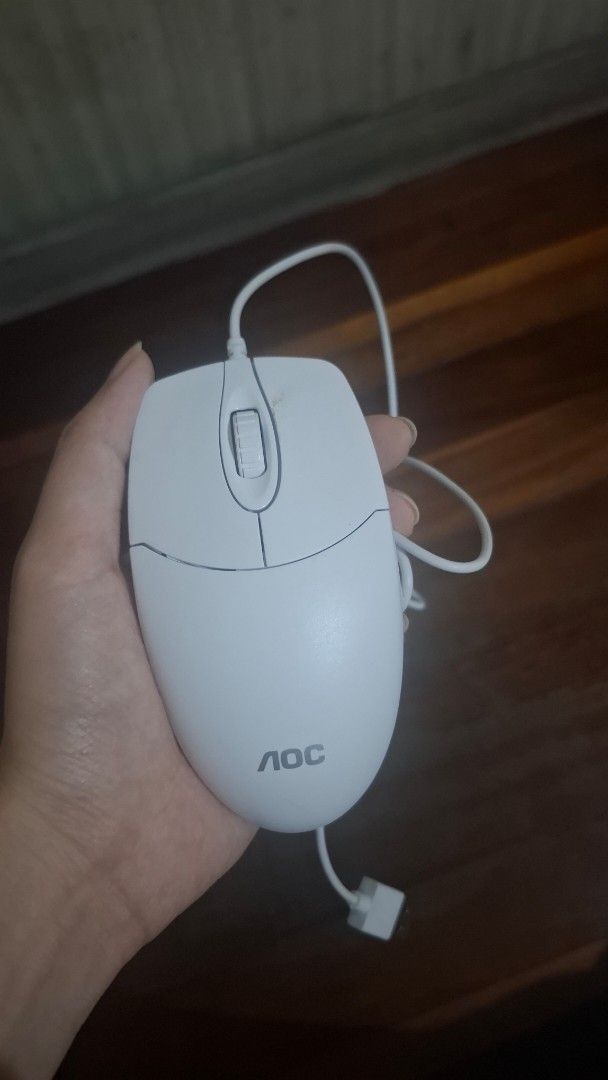 AOC Wired Computer Mouse (Category: Mouse & Mousepads) located in Manila. Submitted by ginacruz899 (Listing ID 1464067308, Image 1). Description: - AOC White Wired Computer Mouse - Reliable performance, works well - Features scroll wheel and two buttons - Easy plug-and-play setup - Ideal for everyday computer use.