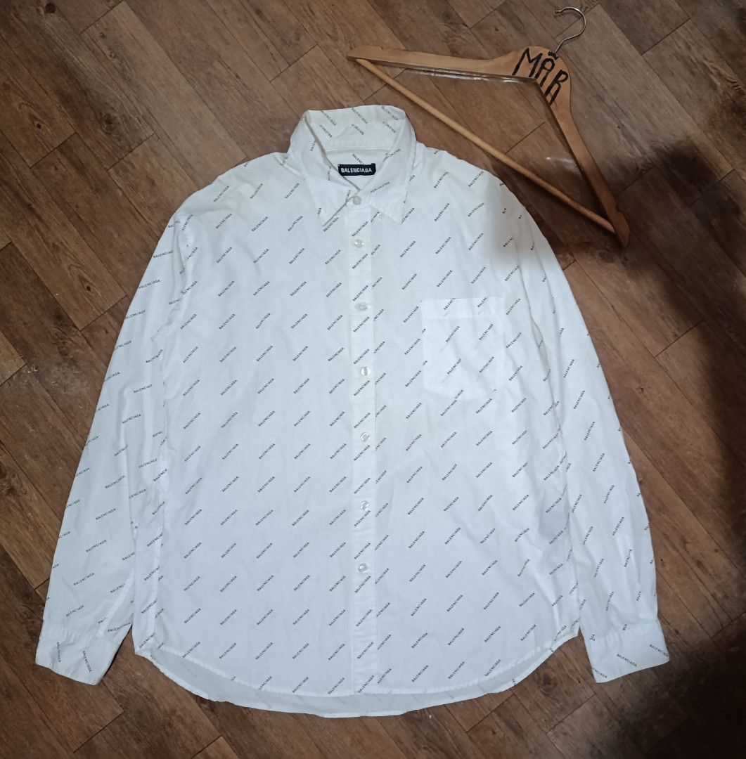 Aop balenciaga button down polo (Category: Luxury Apparel) located in Caloocan City. Submitted by demar916631 (Listing ID 1464050484, Image 1). Description: Balenciaga Mens AOP button down Small on tag best fit large to xl W21.5 L28 Color rate 9.8/10 Excellent condi Need wash only Price: 1879 free sf Dm.