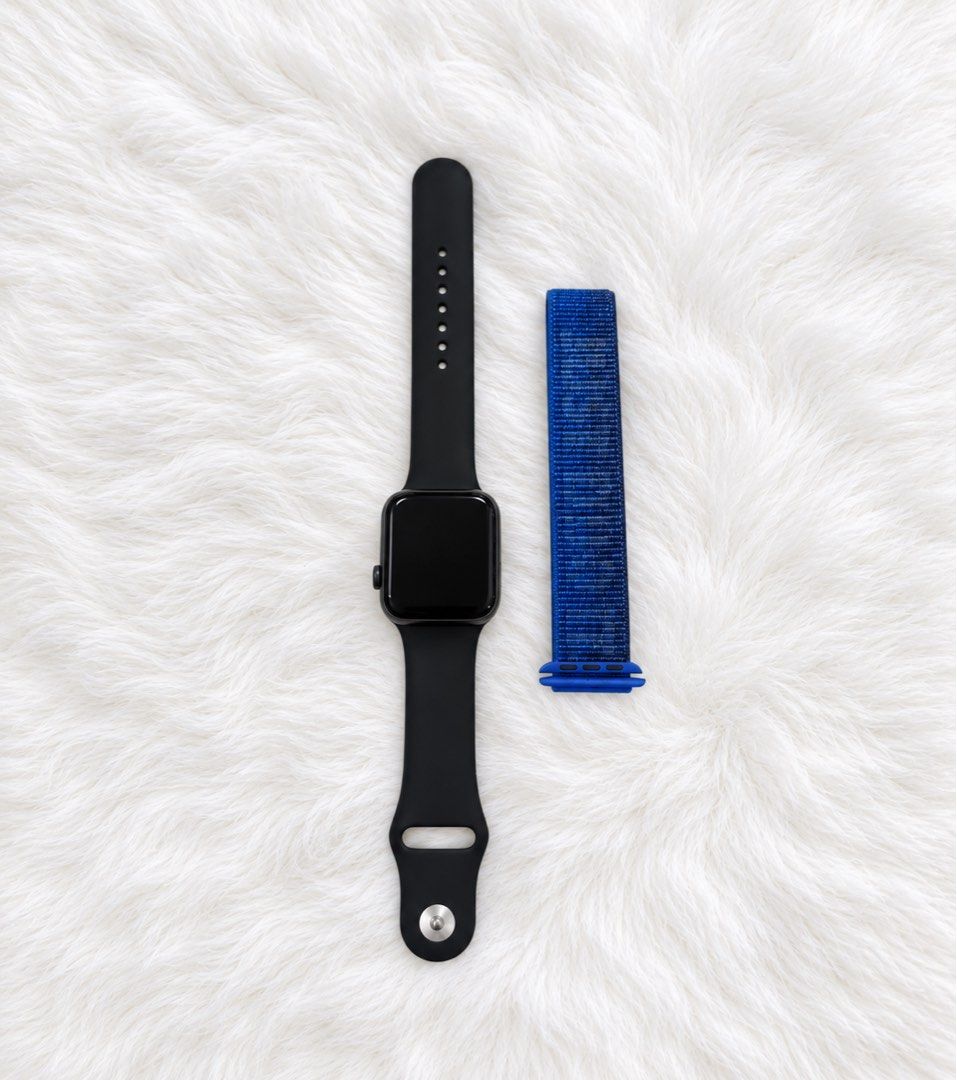 Apple Watch SE 44mm (Category: Wearables & Smart Watches) located in Quezon City. Submitted by kimibery (Listing ID 1464050124, Image 2). Description: - Apple Watch SE 44mm - Color: Black - Case Material: Aluminum - Water Resistance: 50 meters - Includes original black sport band - Comes with an additional blue sport loop band - Bought in California, USA.