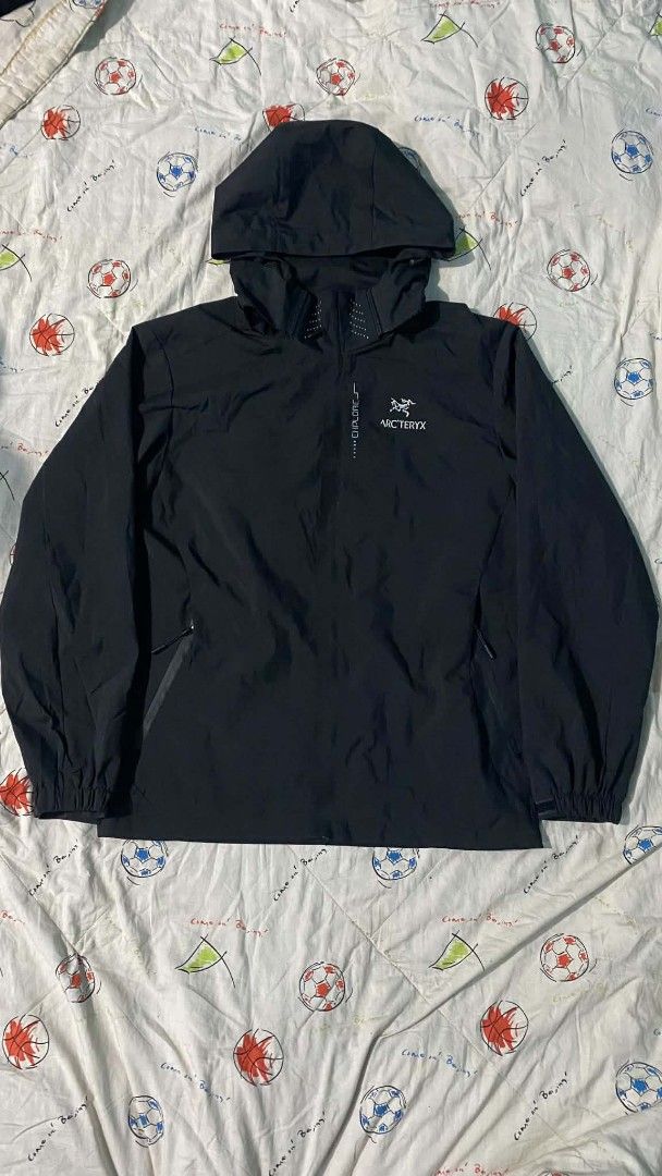 Arc'teryx Black Anorak Jacket with Hood (Category: Coats, Jackets and Outerwear) located in Manila. Submitted by jerms.thriftah (Listing ID 1463972295, Image 1). Description: - Black Arc'teryx anorak jacket - Stowable hood - Reflective "EXPLORE" text and dots on front - Zippered side pockets - Elastic cuffs and hem - Ideal for outdoor activities.