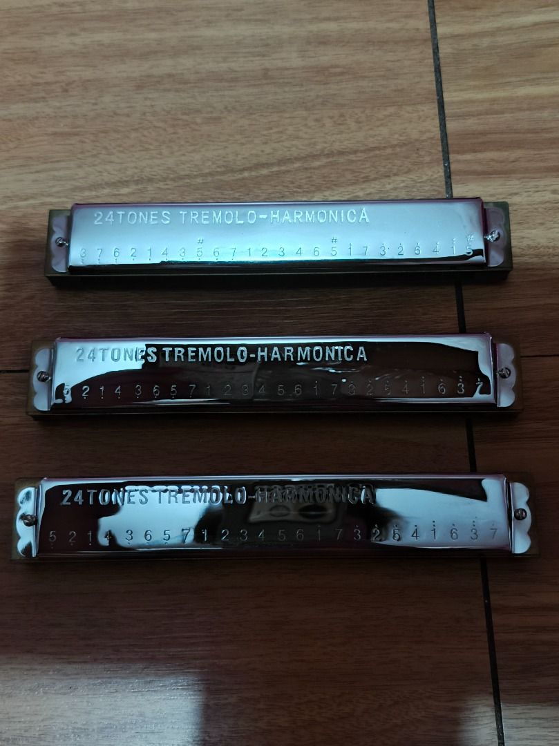 Artisan 24 Tones Tremolo Harmonica (Category: Musical Instruments) located in Makati City. Submitted by nyxhemera26 (Listing ID 1464120213, Image 3). Description: - Set of three Artisan 24 Tones Tremolo Harmonicas - Each harmonica is silver with note markings - Comes with its own red protective case - Ideal for beginners or harmonica collectors - All three harmonicas are included in this set.