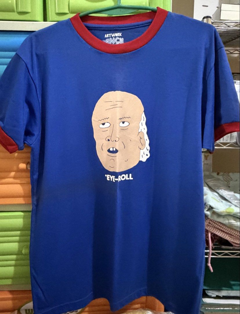 Artwork "Eye-Roll" Graphic T-Shirt (Category: Shirts) located in Manila. Submitted by nayeoniescart (Listing ID 1464104116, Image 2). Description: PRE LOVED MOD: Jnt / MOP: gcash Artwork Blue t-shirt with red trim on collar and sleeves Women tee Size: L.