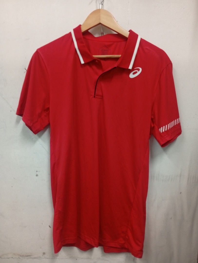 Asics Red Polo Shirt (Category: Tshirts & Polo Shirts ) located in Manila. Submitted by annemanzano120906 (Listing ID 1463946358, Image 1). Description: - Red Asics polo shirt - Short sleeves with a collar - Features the iconic Asics logo on the chest - Includes reflective detailing on the sleeve for added visibility - Ideal for both athletic activities and everyday casual wear.