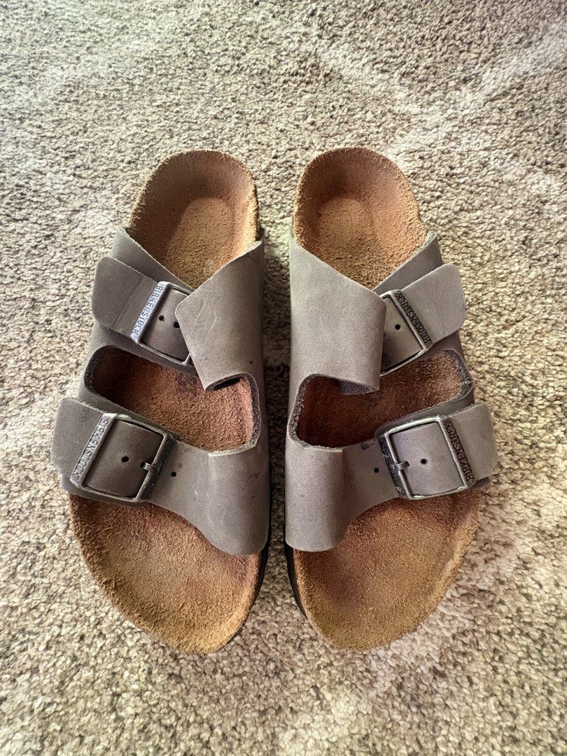 Auth Preloved Birkenstock Arizona (Category: Slippers and slides) located in Paranaque City. Submitted by silentstone.dolphin (Listing ID 1463976617, Image 1). Description: Oiled Leather.. Color Gray Strap.. Soft Footbed.. Brass Buckle.. Clean&Ready to Wear✅ Size 39N.. Super Nice in Actual😍.