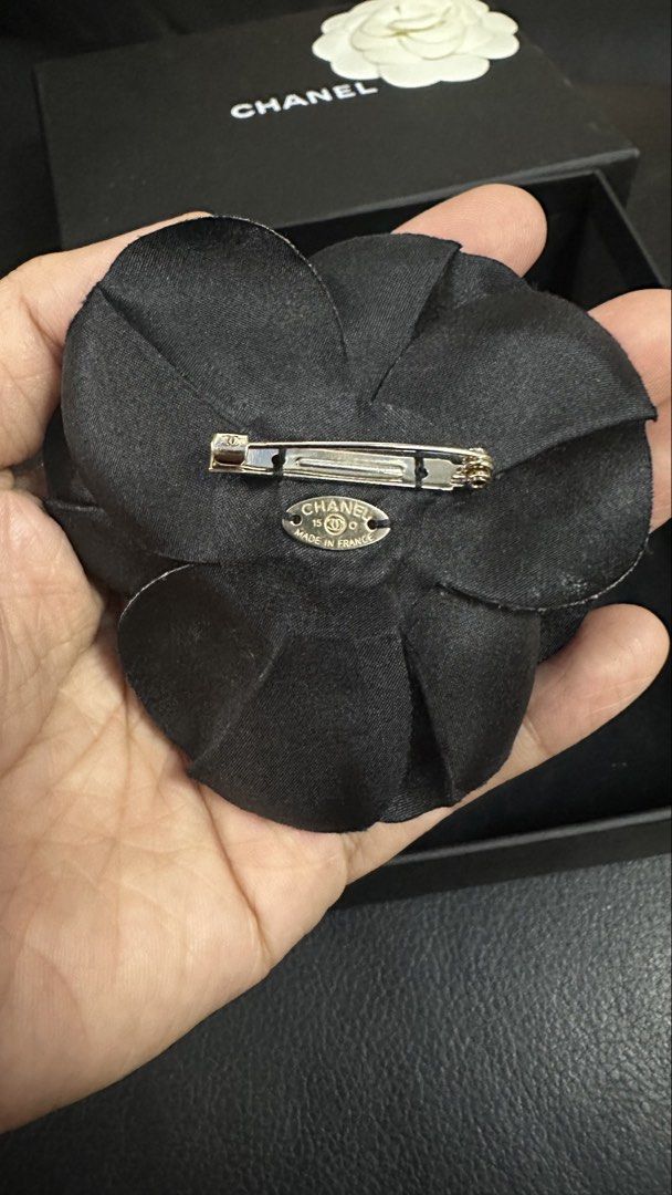 Authentic Chanel Camellia Pin Brooch (Category: Luxury Accessories) located in Las Pinas. Submitted by marshmallowmax (Listing ID 1464022361, Image 3). Description: Guaranteed Authentic! 2 for 15k only If individual price: Gold 9k (with box & dustbag) Black 8k (with paperbag & dustbag).