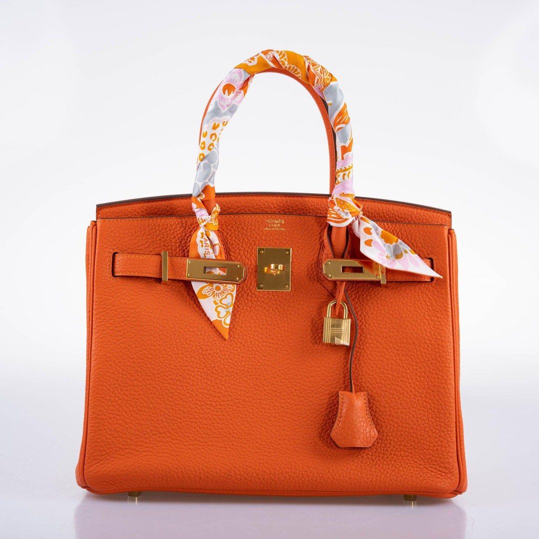 (Authentic) Hermes Birkin 25 (Category: Luxury Bags & Wallets) located in Cordova. Submitted by aux.archive (Listing ID 1463948780, Image 1). Description: Hermes Birkin 25 cm Togo Hermes staple orange Palladium R stamp no enclosure Used few times Dustbag Box Rainkit Carebooklet R stamp no square enclosed.