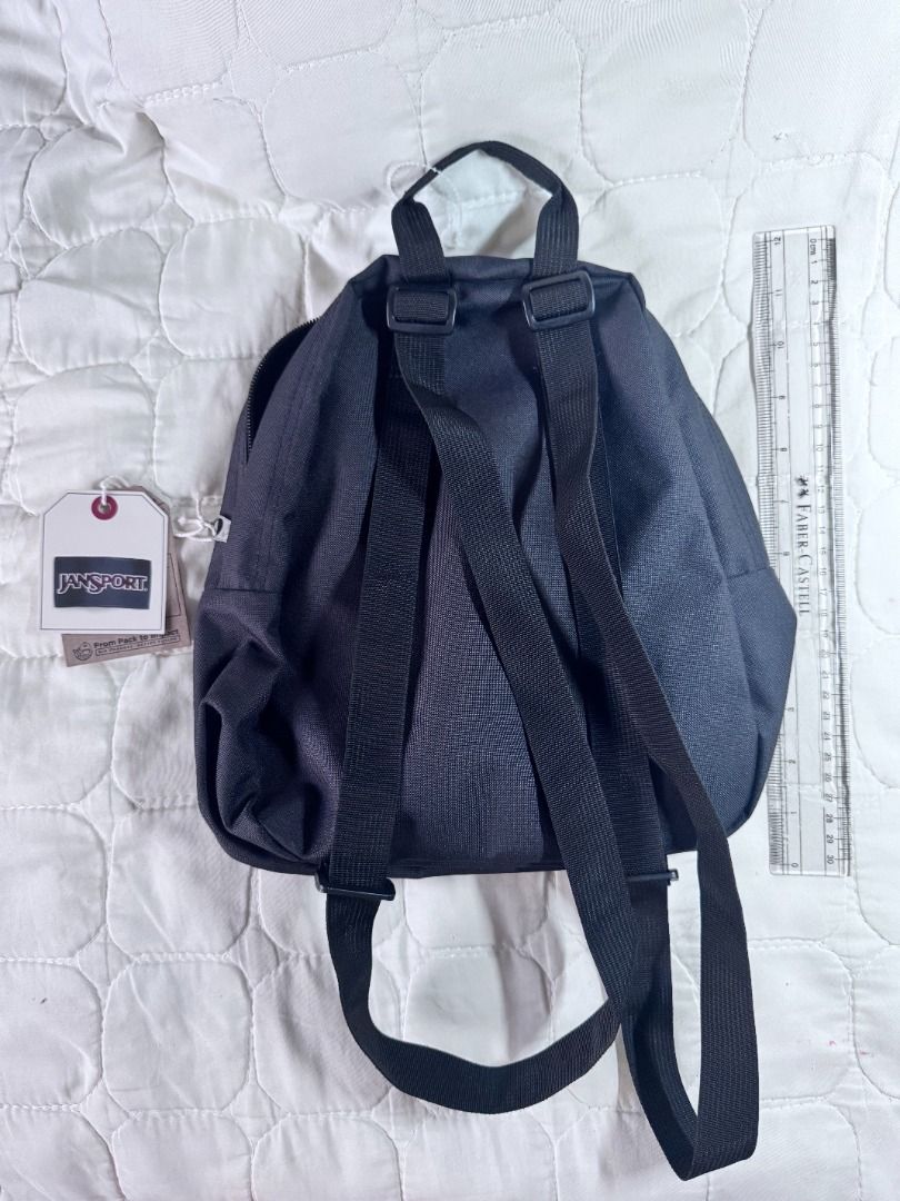Authentic Jansport Half Pint Mini Backpack in black (with tags) (Category: Luxury Bags & Wallets) located in Makati City. Submitted by mbrtom (Listing ID 1463985074, Image 2). Description: Brand new with tags. No issues. Can be gifted this holiday season. Purchased in the US. .