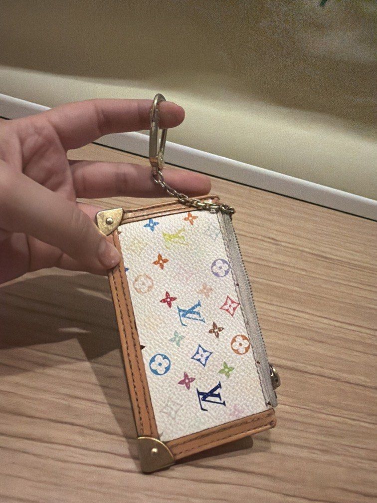 Authentic lv multicolor key cles LP (Category: Purses & Pouches) located in Quezon City. Submitted by theyellowbasket (Listing ID 1464103042, Image 1). Description: Authentic lv multicolor key cles With serial code With heat stamp Issue: repainted edging, metal tarnish, signs of use.