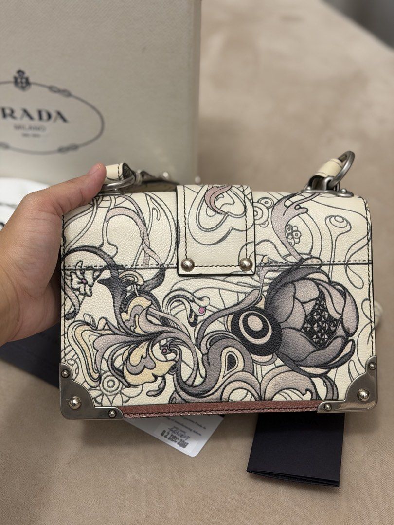 Authentic Prada Limited Edition Rabbit Print Cahier Bag (Category: Luxury Bags & Wallets) located in Manila. Submitted by maria_2326 (Listing ID 1464057648, Image 2). Description: Prada X James Jean Cahier Bag Limited Edition Fits promax Inclusions: Box, dust bag, booklet, and Prada authentication card No lowballing! Location: Manila/QC.
