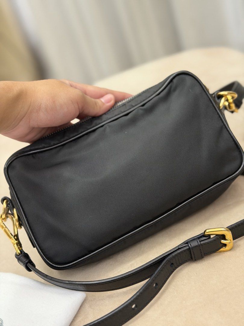 Authentic Prada Tessuto Nylon Camera Bag (Category: Cross-body Bags) located in Manila. Submitted by maria_2326 (Listing ID 1464104698, Image 2). Description: Prada Tessuto Nylon Camera Bag 💯% Authentic W/ dust bag and long strap Flaw: signs of wear, please see last 3 photos Location: Manila/QC.