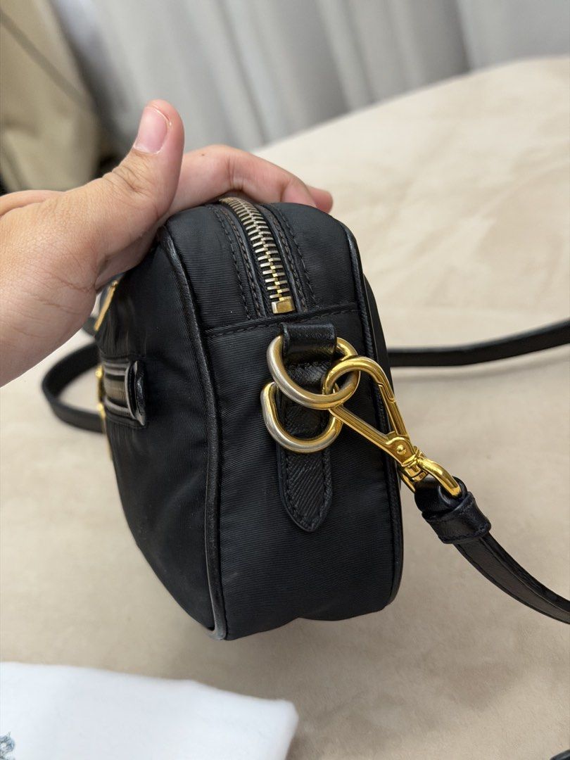 Authentic Prada Tessuto Nylon Camera Bag (Category: Cross-body Bags) located in Manila. Submitted by maria_2326 (Listing ID 1464104698, Image 3). Description: Prada Tessuto Nylon Camera Bag 💯% Authentic W/ dust bag and long strap Flaw: signs of wear, please see last 3 photos Location: Manila/QC.