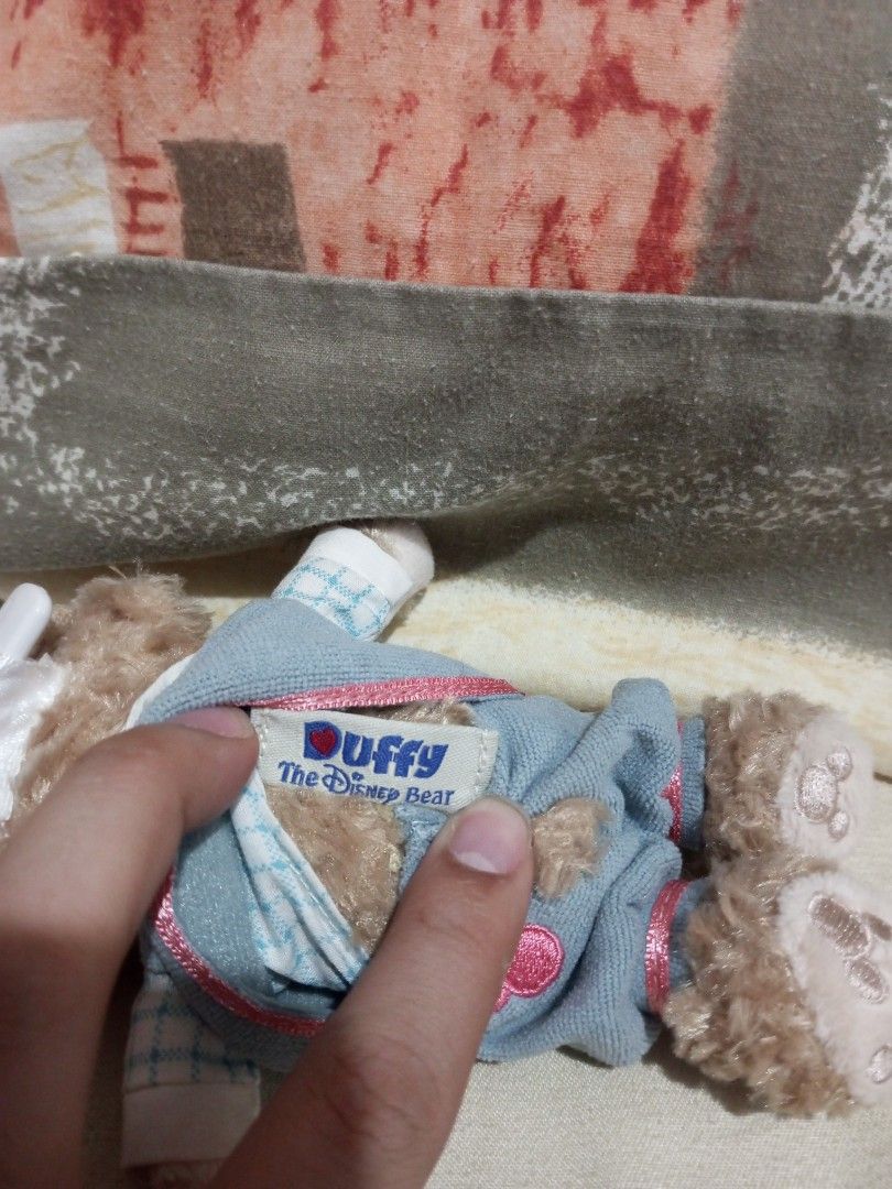 Authentic Tokyo DisneySea Cape Cod 2010 Easter Duffy Plush Badge Keychain" (Category: Plushies & Soft Toys) located in Victorias. Submitted by tobylacua26871 (Listing ID 1464055913, Image 3). Description: - Adorable Duffy the Disney Bear plush toy. - Features a charming blue checkered shirt, vest, and shorts. - Includes a cute little hat. - Stands approximately 15cm tall. - Ideal for Disney collectors or as a thoughtful gift. - Authentically sour