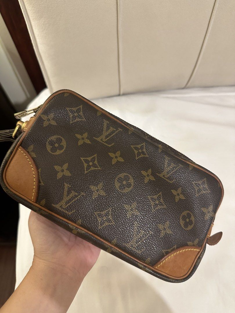 Authentic Vintage Louis Vuitton Monogram Clutch / Wristlet (Category: Clutches) located in Dasmarinas. Submitted by ricaedl (Listing ID 1464031574, Image 3). Description: Authentic vintage Louis Vuitton in classic Monogram canvas. Year 1997 Beautiful vintage LV piece that can be used as a clutch, wristlet or travel pouch. Overall in good vintage condition considering its age. • Monogram canvas is still in good condition • Original wrist strap inc