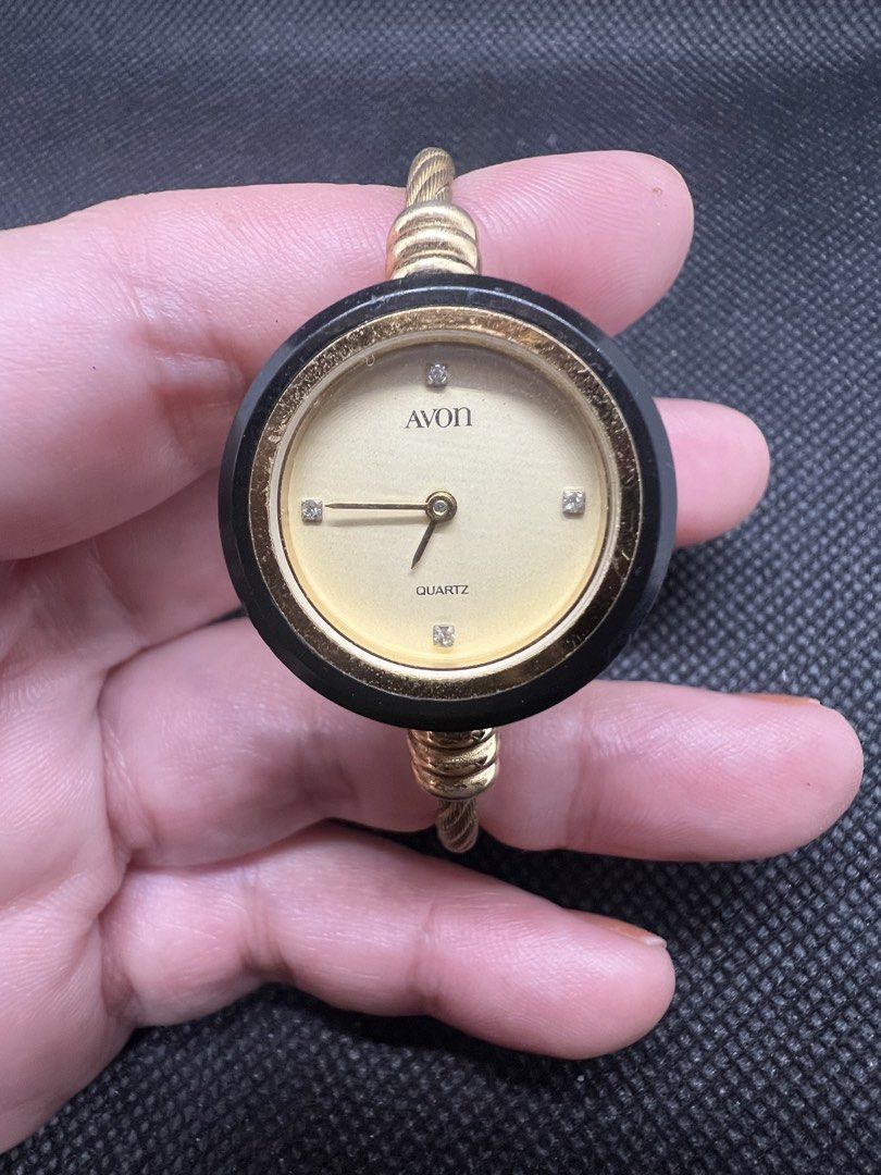 Avon Japan Bangle Quartz Ladies Watch (Category: Women's Watches) located in Pasig City. Submitted by lailahbeauty (Listing ID 1464037060, Image 2). Description: For sale onhand Avon Bangle Japan Quartz ladies Watch. Original Preloved watch direct from Japan. Working product. For more details you can contact me directly for fast transaction. Buy now! I can shipping nationwide! - Gold-tone Avon watch - Black bezel - Cream dial with diamond accents