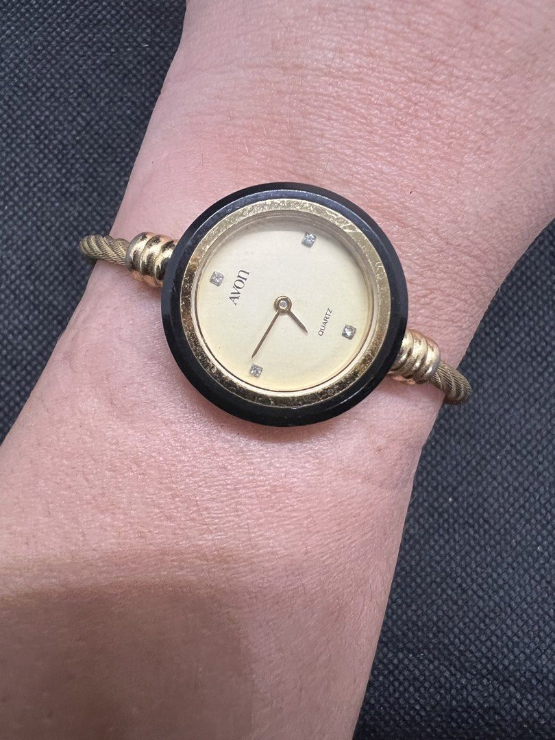 Avon Japan Bangle Quartz Ladies Watch (Category: Women's Watches) located in Pasig City. Submitted by lailahbeauty (Listing ID 1464037060, Image 1). Description: For sale onhand Avon Bangle Japan Quartz ladies Watch. Original Preloved watch direct from Japan. Working product. For more details you can contact me directly for fast transaction. Buy now! I can shipping nationwide! - Gold-tone Avon watch - Black bezel - Cream dial with diamond accents