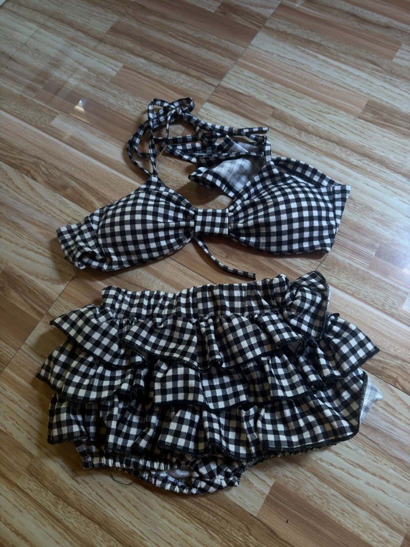 Gingham Ruffle Swimsuit Set (Category: Bikinis & Swimsuits) located in San Vicente. Submitted by chinn5 (Listing ID 1463979766, Image 1). Description: - Adorable swimsuit set - Classic black and white gingham pattern - Top with adjustable tie straps - Bottoms with cute all-around ruffles - Soft and comfortable fabric - Ideal for beach trips and pool days -used once only.