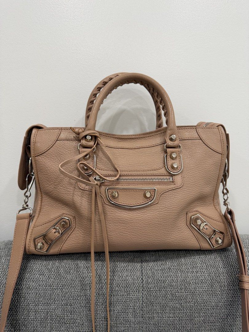 Balenciaga City Metallic Edge Small (Category: Luxury Bags & Wallets) located in Paranaque City. Submitted by prelovedbyabanana (Listing ID 1464136138, Image 1). Description: Size: Small Color way: Rose Des Sables (nude pink with taupe undertones) Silver hardware With mirror and complete tassels CLEAN corners and interior Complete paper tags with leather swatch and original copy of store receipt (bought Dec. 2017 in California, USA) Almost flawle