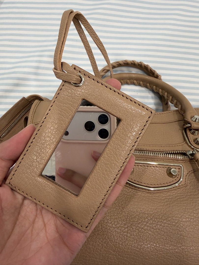 Balenciaga City Metallic Edge Small (Category: Luxury Bags & Wallets) located in Paranaque City. Submitted by prelovedbyabanana (Listing ID 1464136138, Image 3). Description: Size: Small Color way: Rose Des Sables (nude pink with taupe undertones) Silver hardware With mirror and complete tassels CLEAN corners and interior Complete paper tags with leather swatch and original copy of store receipt (bought Dec. 2017 in California, USA) Almost flawle
