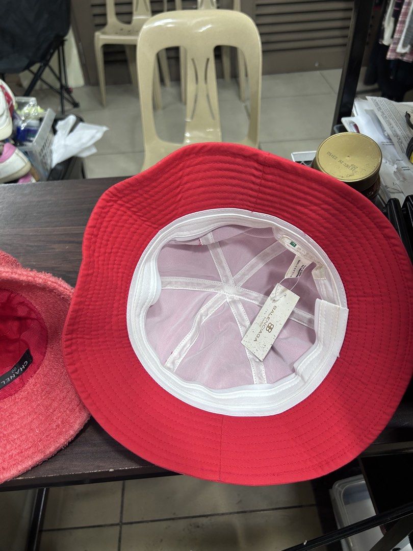 Balenciaga Red BB Logo Bucket Hat (Category: Caps & Hats) located in Pasig City. Submitted by blitzkriegspc (Listing ID 1464136467, Image 3). Description: - Authentic Balenciaga red bucket hat - Features iconic BB logo on the front - Comes with original tags attached - One size fits most - Ideal for sunny weather and stylish protection.