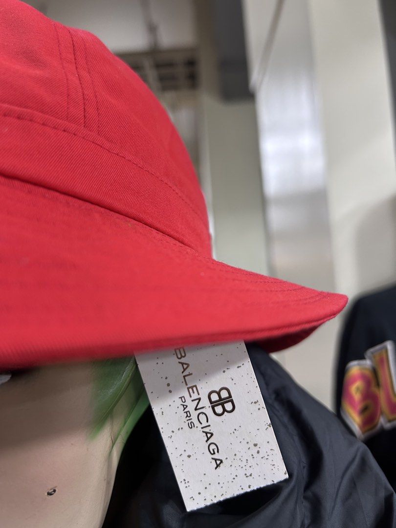 Balenciaga Red BB Logo Bucket Hat (Category: Caps & Hats) located in Pasig City. Submitted by blitzkriegspc (Listing ID 1464136467, Image 2). Description: - Authentic Balenciaga red bucket hat - Features iconic BB logo on the front - Comes with original tags attached - One size fits most - Ideal for sunny weather and stylish protection.