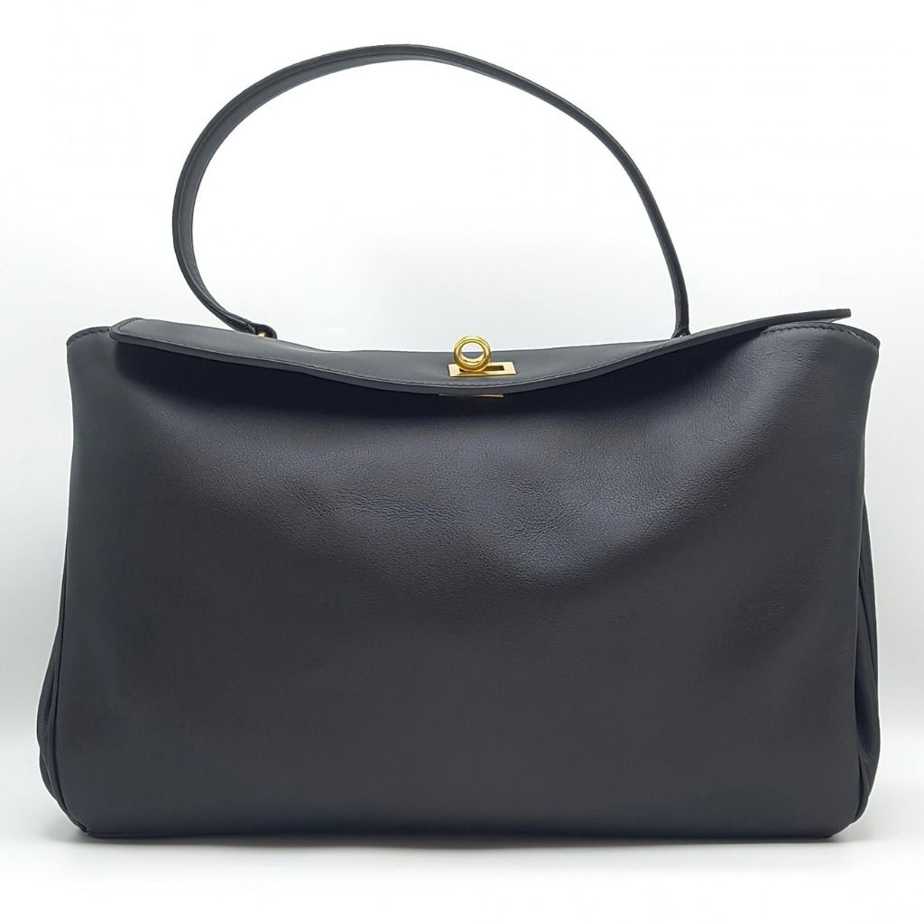 Balenciaga Rodeo Medium Bag Black (Category: Luxury Bags & Wallets) located in Cebu City. Submitted by theluxxaffair (Listing ID 1463987523, Image 1). Description: Balenciaga Rodeo Medium bag in black smooth calfskin leather with aged-gold hardware. Features a top handle, removable shoulder strap, turn-lock closure and wide front pocket. Spacious nappa leather-lined interior with zip and flat pockets. Includes removable leather cloche with split 
