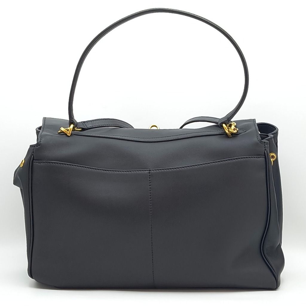 Balenciaga Rodeo Medium Bag Black (Category: Luxury Bags & Wallets) located in Cebu City. Submitted by theluxxaffair (Listing ID 1463987523, Image 2). Description: Balenciaga Rodeo Medium bag in black smooth calfskin leather with aged-gold hardware. Features a top handle, removable shoulder strap, turn-lock closure and wide front pocket. Spacious nappa leather-lined interior with zip and flat pockets. Includes removable leather cloche with split 