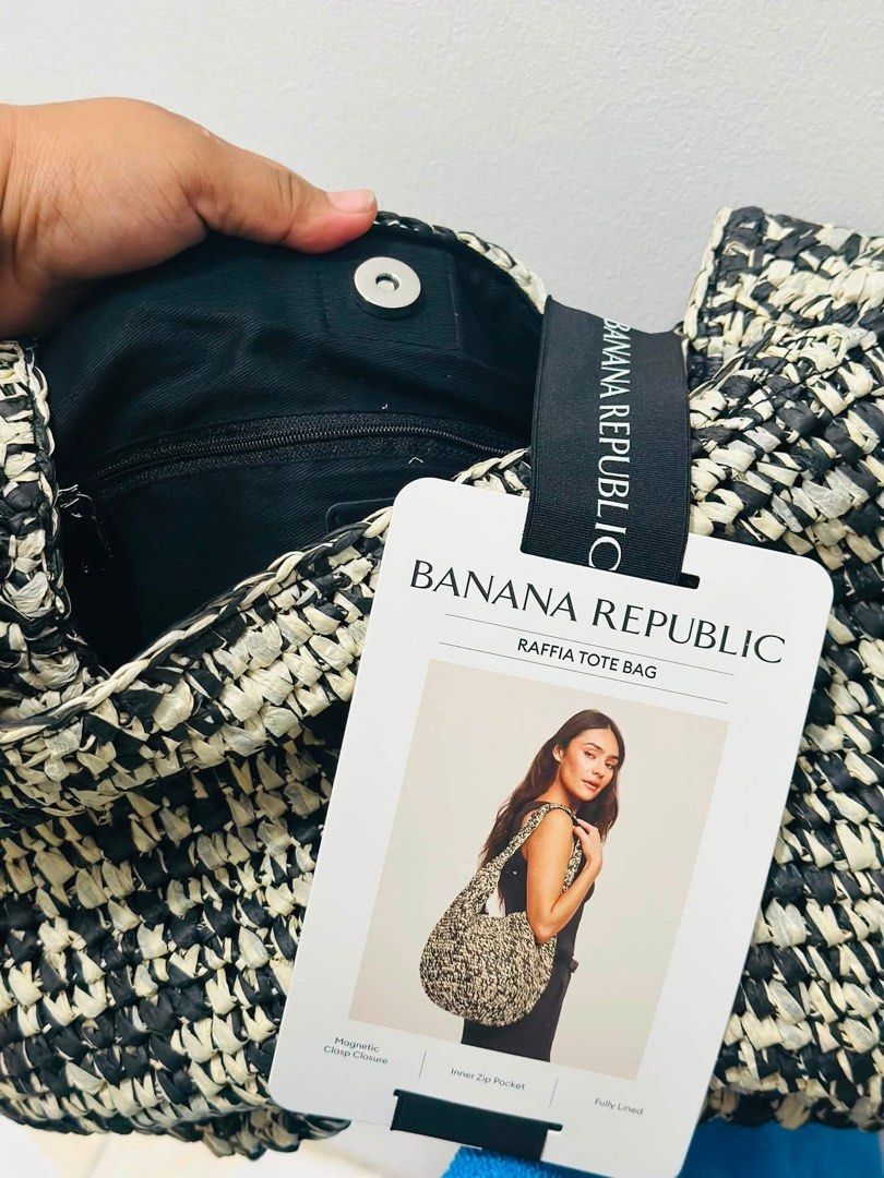BANANA REPUBLIC RAFFIA TOTE BAG (Category: Tote Bags) located in Manila. Submitted by margaux22_ (Listing ID 1464089816, Image 3). Description: FOR SALE: BANANA REPUBLIC RAFFIA TOTE BAG Bought in Singapore New; bever been used RFS: impulsive buying P3,000 Features: Handwoven raffia Top clasp closure Round, flat bottom Fully lined interior Secure-zip and drop-in pockets Colours: black or beige Fabric Content: Shell: 100% paper Lining: 100% cotton 