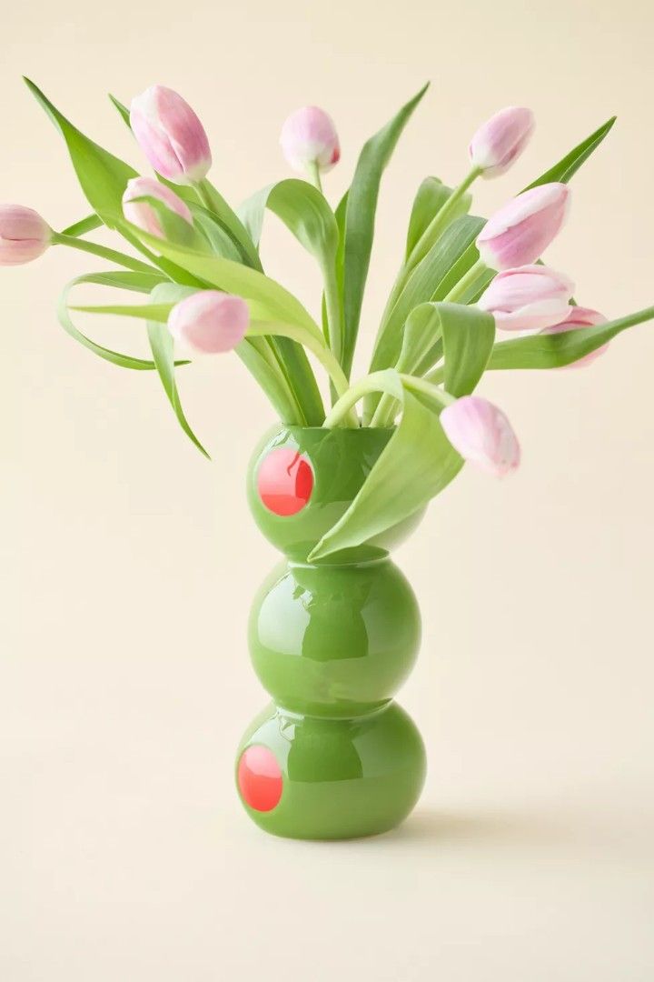 ban.do stacked olives novelty ceramic Vase (Category: Vases & Decorative Bowls) located in Calamba. Submitted by princesspauliney. (Listing ID 1464006747, Image 1). Description: Inspired by cocktail hour, this ceramic flower vase from ban.do features a stacked olive silhouette. Perfect for the maximalist space, use this flower vase for your fresh or dried stems. Features - ban.do Stacked Olive Ceramic Vase - Ceramic flower vase in a kitschy olive