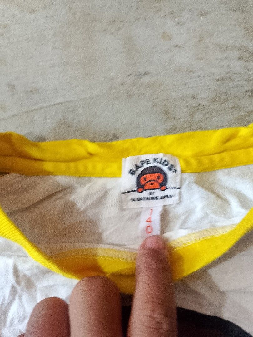 BAPE KIDS L/S Tee (size 140) (Category: Babies & Kids Fashion) located in Surigao. Submitted by luffytrift (Listing ID 1463991853, Image 2). Description: BAPE KIDS L/S Tee (size 140) Dimension: L 20 x W 16 Excellent Condition Color rate: 9.5 Issue: Last picture.