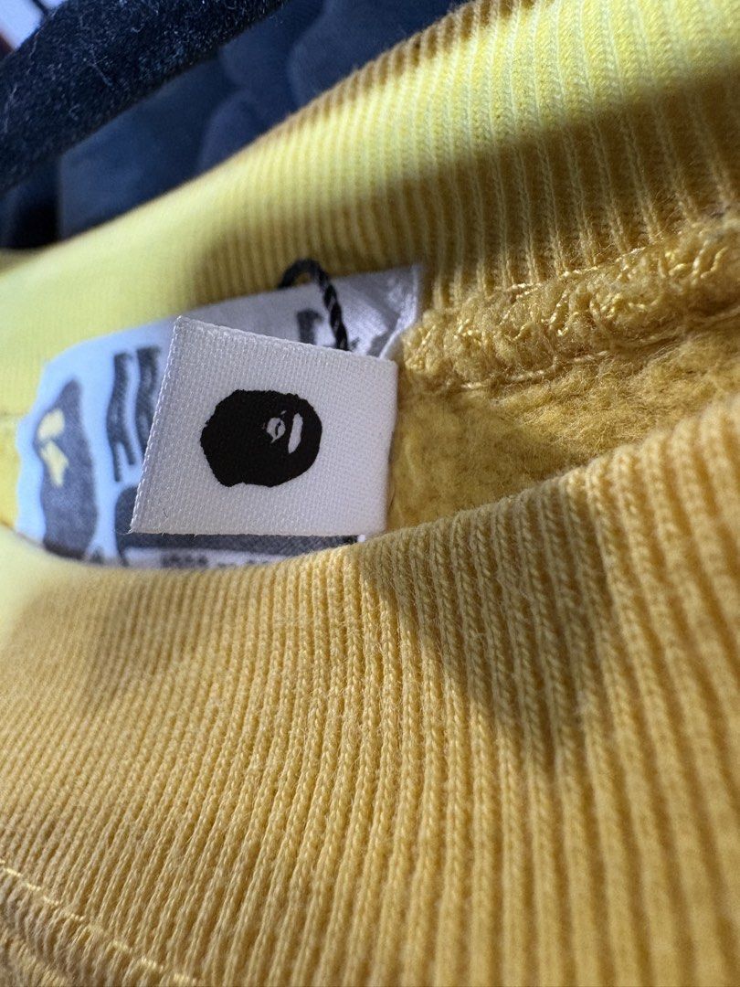 Bape Yellow Crewneck College Logo (Category: Activewear) located in Manila. Submitted by bravestone14 (Listing ID 1464087925, Image 3). Description: Bape Yellow Crewneck College Logo 22x28 No issue excellent condition 2800+sf Thankyou and appreciate✨.