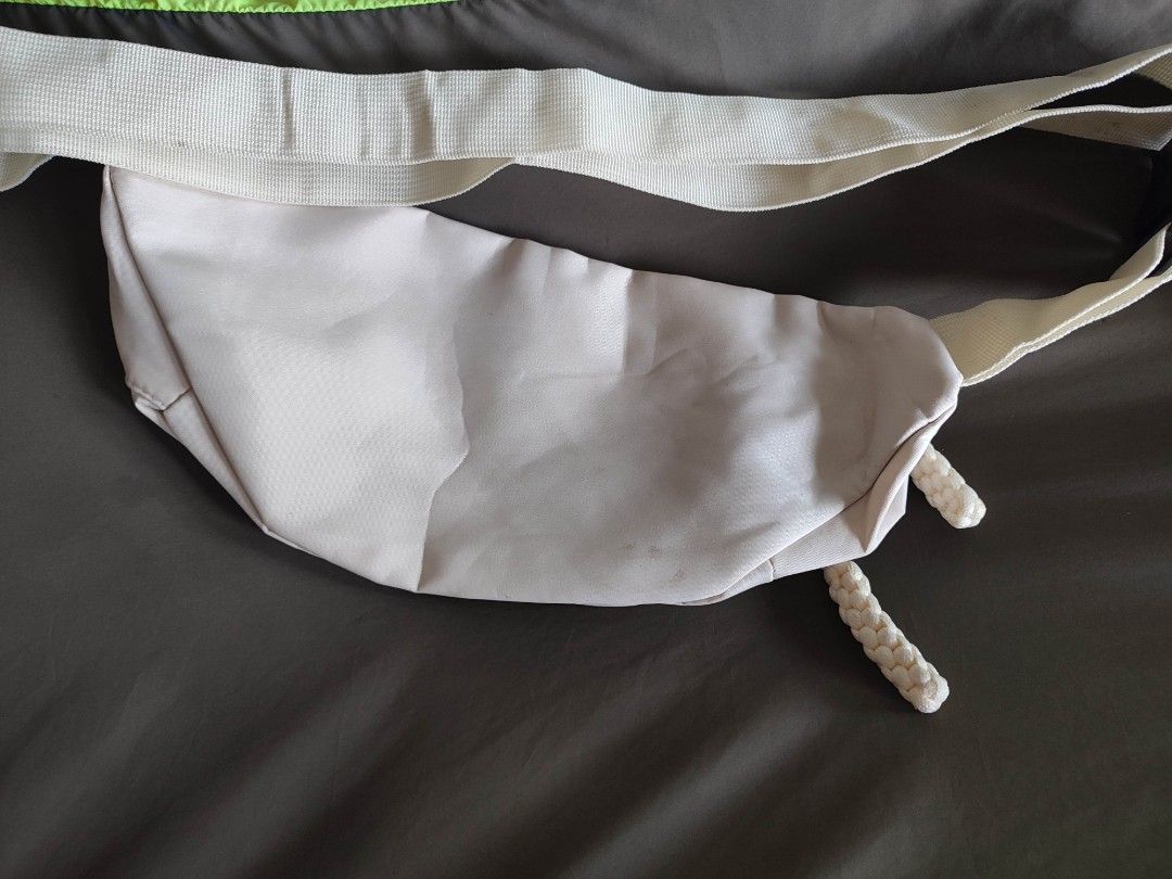Beige Fanny Pack / Waist Bag with Adjustable Strap (Category: Cross-body Bags) located in Mangaldan. Submitted by michelle_2004 (Listing ID 1463961249, Image 2). Description: - Beige fanny pack - Two front zip pockets - Main compartment - Adjustable strap with buckle closure - Durable nylon-like material - Ideal for keeping essentials handy.