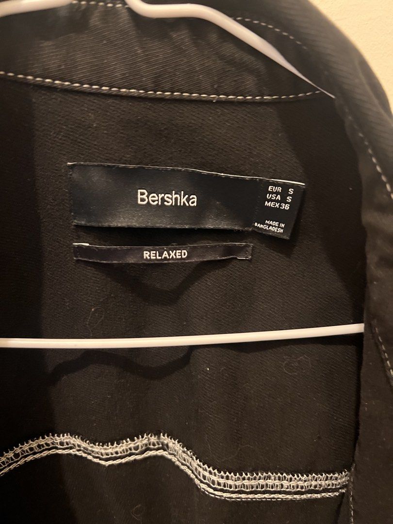 Bershka Black Relaxed Fit Jacket with White Stitching (Category: Coats, Jackets and Outerwear) located in Las Pinas. Submitted by basicapparel_mnl (Listing ID 1463987916, Image 3). Description: - Black Bershka jacket - Relaxed fit - Size S - White contrast stitching throughout - Two chest pockets with button closure - Button-up front - Made in Bangladesh - Great for layering.