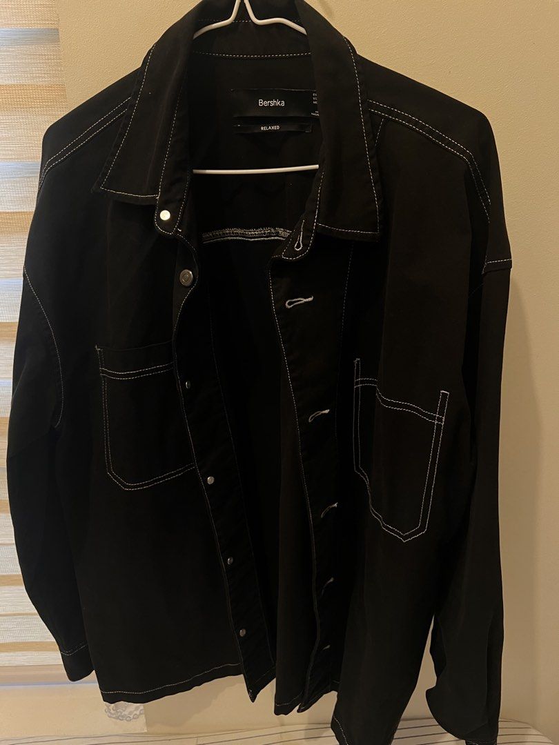 Bershka Black Relaxed Fit Jacket with White Stitching (Category: Coats, Jackets and Outerwear) located in Las Pinas. Submitted by basicapparel_mnl (Listing ID 1463987916, Image 2). Description: - Black Bershka jacket - Relaxed fit - Size S - White contrast stitching throughout - Two chest pockets with button closure - Button-up front - Made in Bangladesh - Great for layering.