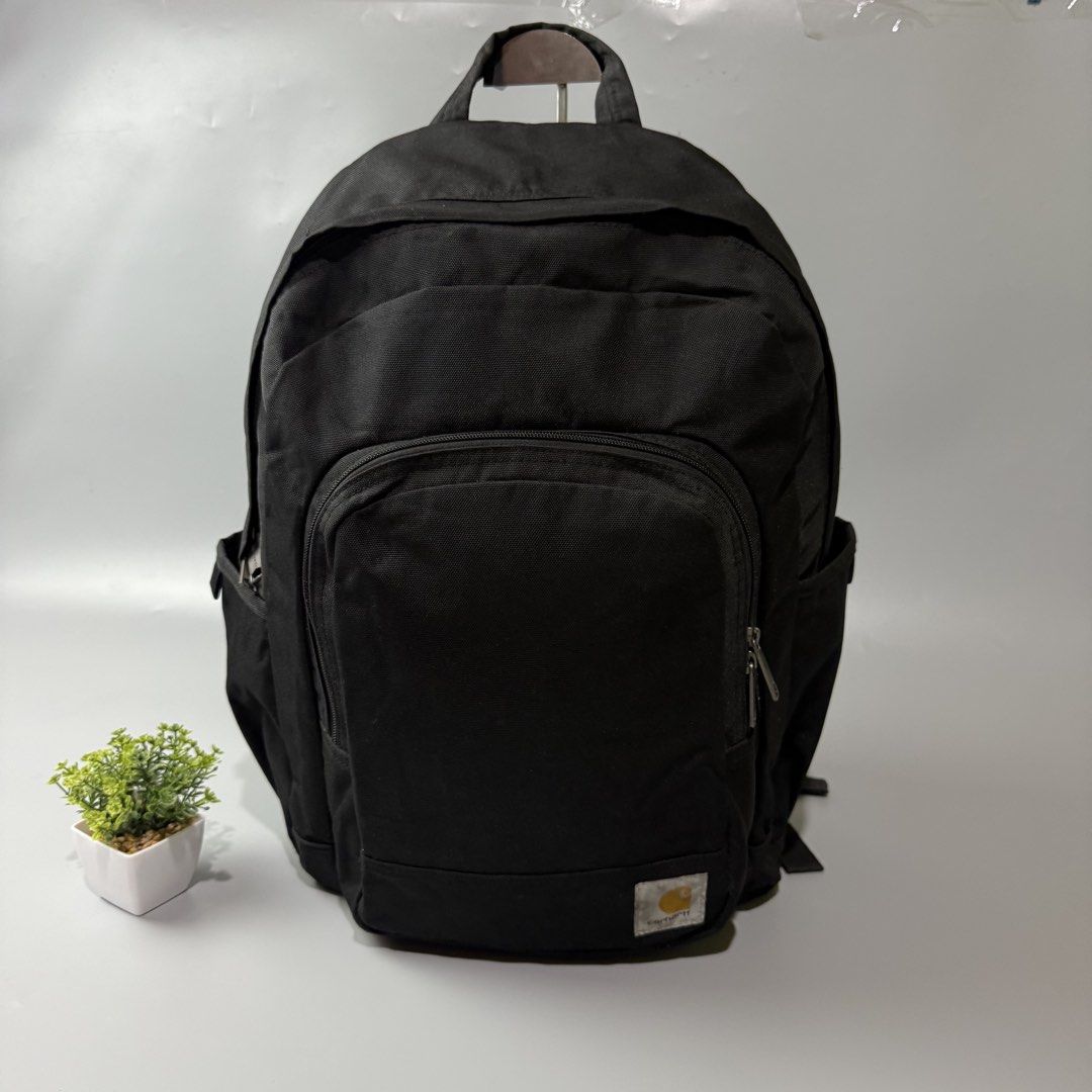 Black Carhartt Backpack (Category: Backpacks) located in Bago City. Submitted by g___shop (Listing ID 1464047129, Image 1). Description: - Classic black Carhartt backpack - Durable canvas material - Spacious main compartment - Front zip pocket - Side pockets for extra storage - Ideal for school or everyday use - Ready for a new owner.