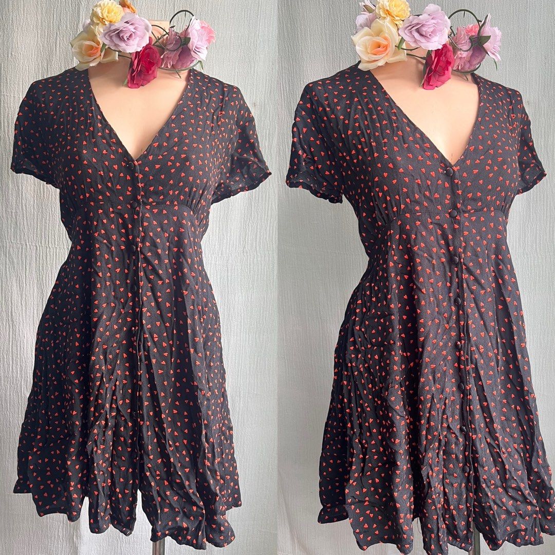 Black Dress with Red Heart Pattern (Category: Dresses) located in Quezon City. Submitted by charlenedv58782 (Listing ID 1463950009, Image 1). Description: 🥀 SIZE: SMALL TO MEDIUM 🥀BRAND: GLASSONS 🌺VISCOSE FABRIC, BUTTONS WORKING, WITH PATALI SA LIKOD NO FLAWS, GANDA NITO PAG SUOT SUPER CUTE - Adorable black dress with a playful all-over red heart pattern. - Features short sleeves and a flattering V-neckline. - Convenient button-up front closur