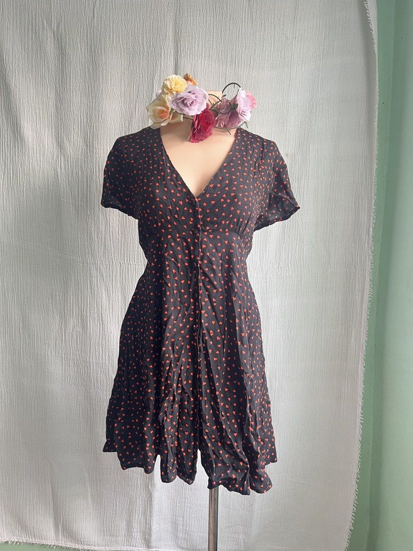 Black Dress with Red Heart Pattern (Category: Dresses) located in Quezon City. Submitted by charlenedv58782 (Listing ID 1463950009, Image 2). Description: 🥀 SIZE: SMALL TO MEDIUM 🥀BRAND: GLASSONS 🌺VISCOSE FABRIC, BUTTONS WORKING, WITH PATALI SA LIKOD NO FLAWS, GANDA NITO PAG SUOT SUPER CUTE - Adorable black dress with a playful all-over red heart pattern. - Features short sleeves and a flattering V-neckline. - Convenient button-up front closur