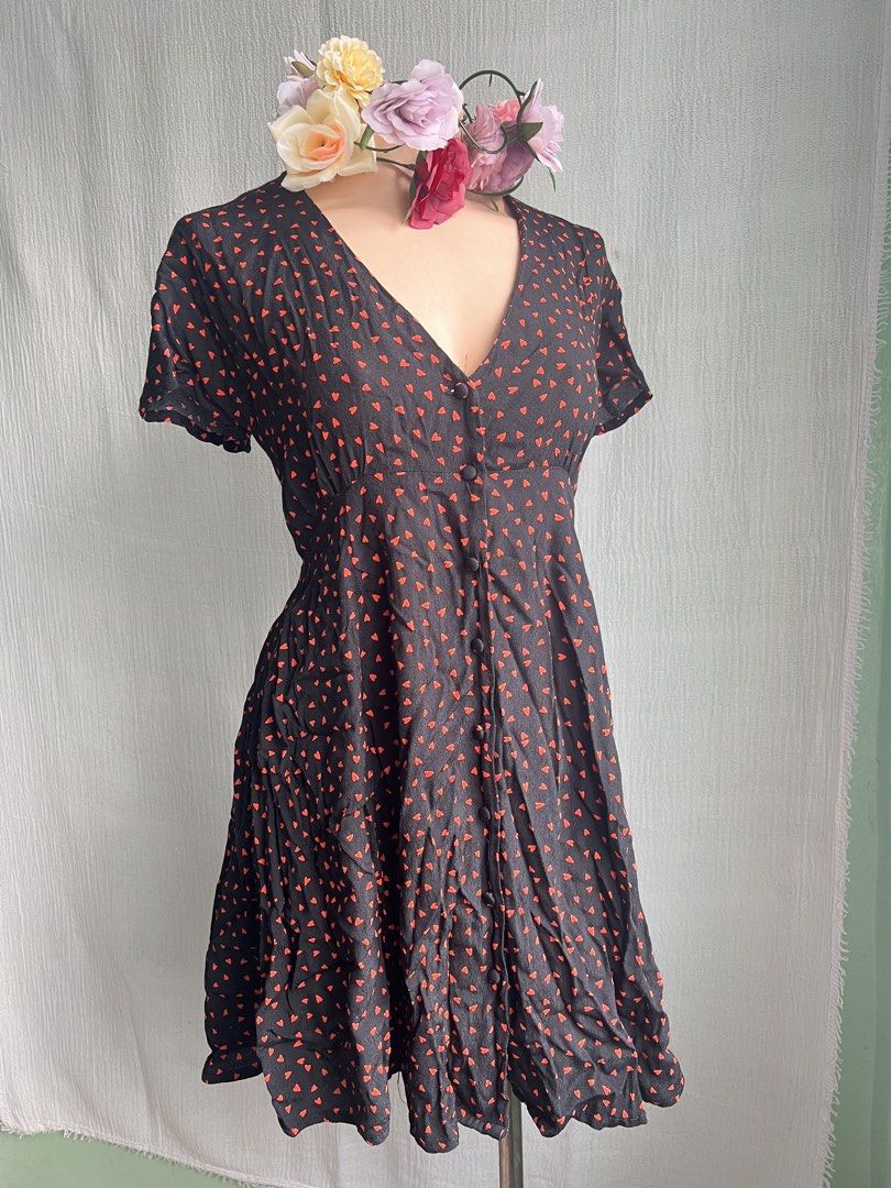Black Dress with Red Heart Pattern (Category: Dresses) located in Quezon City. Submitted by charlenedv58782 (Listing ID 1463950009, Image 3). Description: 🥀 SIZE: SMALL TO MEDIUM 🥀BRAND: GLASSONS 🌺VISCOSE FABRIC, BUTTONS WORKING, WITH PATALI SA LIKOD NO FLAWS, GANDA NITO PAG SUOT SUPER CUTE - Adorable black dress with a playful all-over red heart pattern. - Features short sleeves and a flattering V-neckline. - Convenient button-up front closur