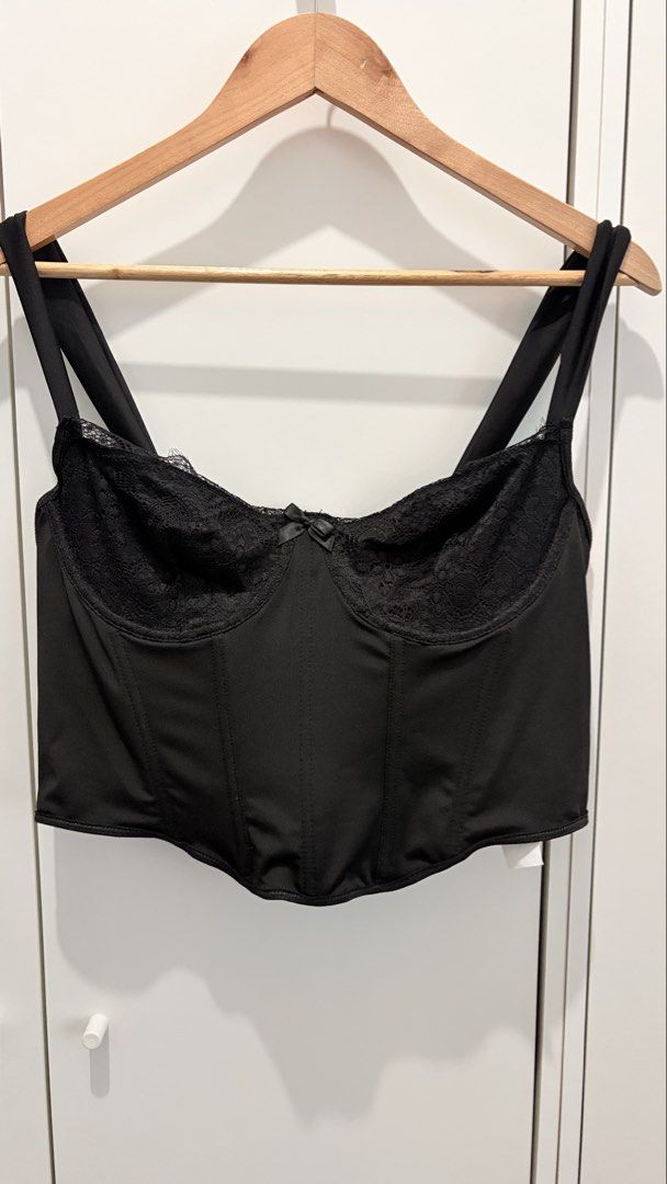 Black Lace Trim Corset Top with Straps Plus Size (Category: Sleeveless) located in Manila. Submitted by katehannie (Listing ID 1464005764, Image 2). Description: - Bust: 40 in, Waist: 32-37 - Black corset top, Stretchy fabric with Boning - Lace trim along the bust - Adjustable straps - Hook-and-eye closure at the back - Flattering silhouette - Party top, corset, formal - Perfect for dressing up or down, pairs well with jeans or leather pants.