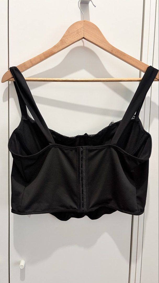 Black Lace Trim Corset Top with Straps Plus Size (Category: Sleeveless) located in Manila. Submitted by katehannie (Listing ID 1464005764, Image 3). Description: - Bust: 40 in, Waist: 32-37 - Black corset top, Stretchy fabric with Boning - Lace trim along the bust - Adjustable straps - Hook-and-eye closure at the back - Flattering silhouette - Party top, corset, formal - Perfect for dressing up or down, pairs well with jeans or leather pants.