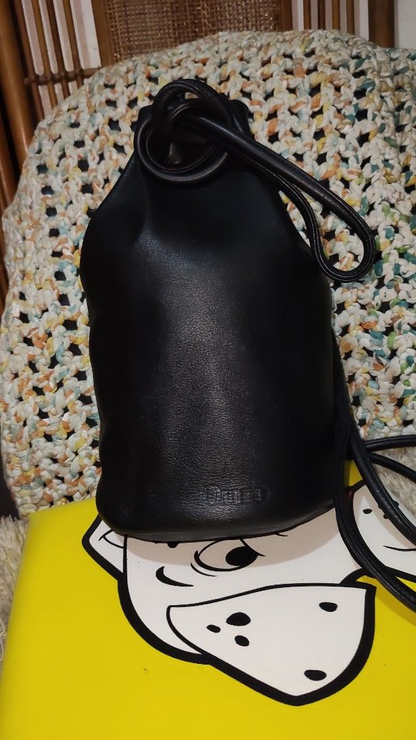 Black Leather Bucket Bag (Category: Backpacks) located in Cebu City. Submitted by lumaynojes00490 (Listing ID 1463963677, Image 3). Description: - Classic black leather bucket bag - Secure drawstring closure - Comfortable shoulder strap - Simple and chic design - Ideal for everyday use - Fits all your essentials - Convenient size for on-the-go - A truly versatile accessory.