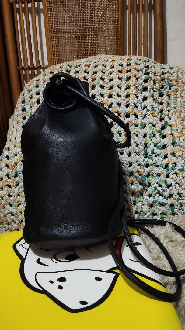 Black Leather Bucket Bag (Category: Backpacks) located in Cebu City. Submitted by lumaynojes00490 (Listing ID 1463963677, Image 1). Description: - Classic black leather bucket bag - Secure drawstring closure - Comfortable shoulder strap - Simple and chic design - Ideal for everyday use - Fits all your essentials - Convenient size for on-the-go - A truly versatile accessory.