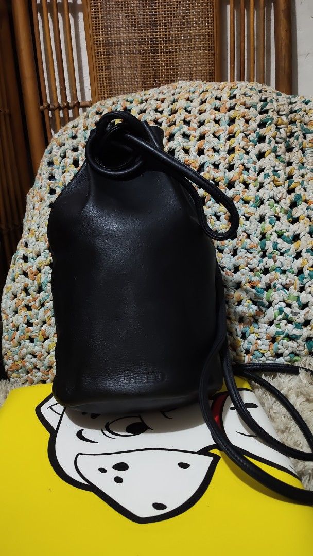 Black Leather Bucket Bag (Category: Backpacks) located in Cebu City. Submitted by lumaynojes00490 (Listing ID 1463963677, Image 2). Description: - Classic black leather bucket bag - Secure drawstring closure - Comfortable shoulder strap - Simple and chic design - Ideal for everyday use - Fits all your essentials - Convenient size for on-the-go - A truly versatile accessory.